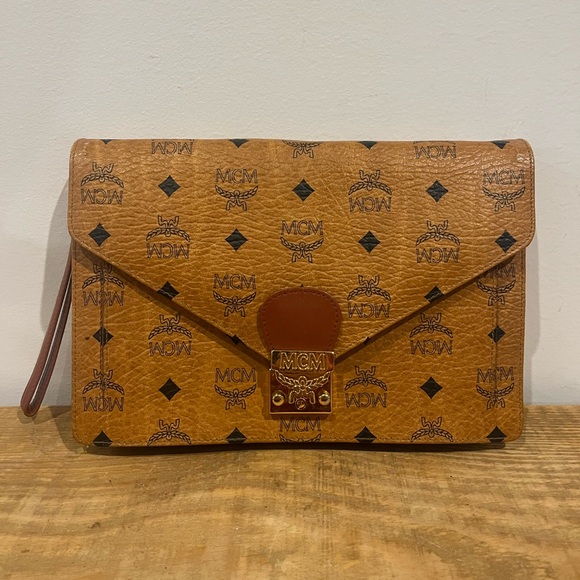 MCM Handbags - MCM authentic monogram vintage brown wristlet clutch EUC comes with keys